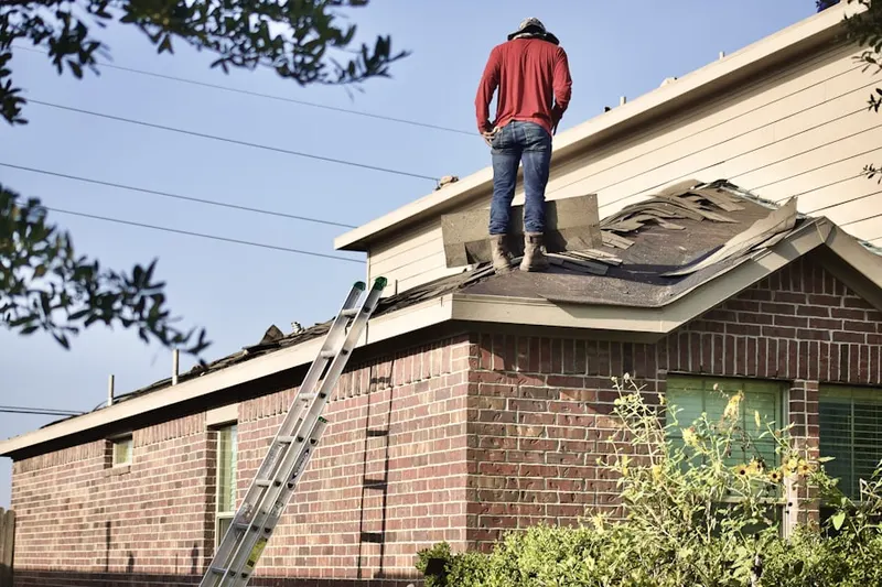 Professional roofer working on a residential roof in Sunnycrest